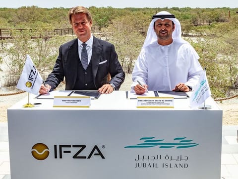 Martin G. Pedersen, Chairman of IFZA, and Eng. Abdullah Saeed Al Shamsi, Corporate Director of Jubail Island Investment Company, at the signing ceremony for the Grow Initiative
