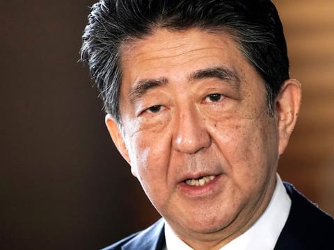 Shinzo Abe speaks to the media in Tokyo on September 16, 2020. A former prime minister and one of Japan’s most powerful and influential figures, Abe died after being shot during a campaign speech in western Japan on July 8, 2022.