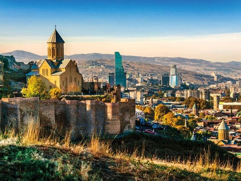 View of Narikala fortress in Tbilisi, the capital of Georgia. Singles and young couples who want a quick getaway are looking at destinations without visa requirements, such as Georgia and Azerbaijan.