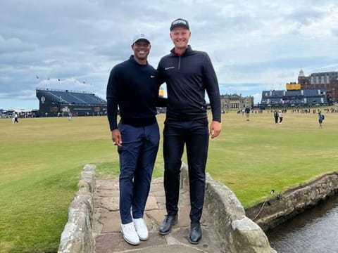 Brush with the Tiger: Adrian Meronk, Dubai-based Polish golfer, with Tiger Woods after a practice round at the back nine at St Andrews.