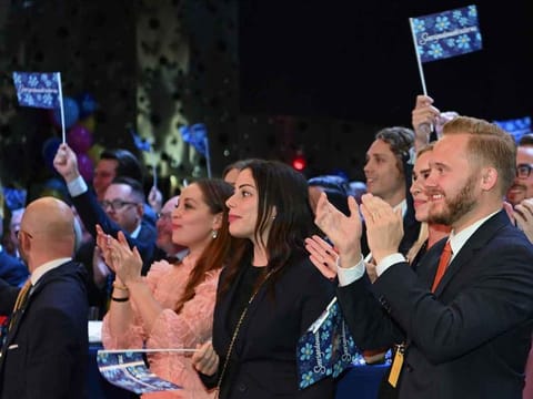 Supporters of the Sweden Democrats cheer during the Party's election night in Nacka, near Stockholm on September 11, 2022.