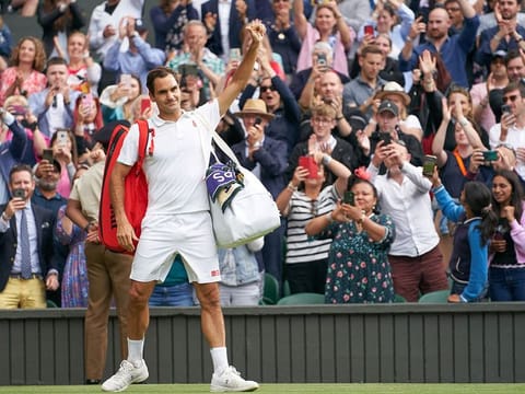 Swiss great Roger Federer waving farewell to the Centre Court fans after losing to Hubert Hurkacz in the quarter-finals at All England Lawn Tennis and Croquet Club.