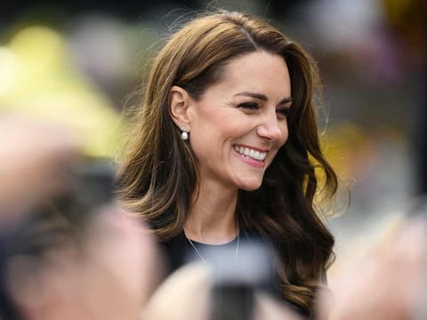 Britain's Catherine, Princess of Wales reacts as she speaks to members of the public outside Norwich Gate on the Sandringham Estate in Sandringham, eastern England.