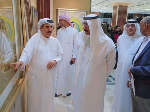 Mohammed Al Murr, Chairman of Mohammed bin Rashid Al Maktoum Library Foundation, seen while calligrapher Hakim Ghannam talks about his work during the inauguration of a grand art exhibition under the title of 'Al Owais Symposium on Arabic Calligraphy' at the Sultan Bin Ali Al Owais Cultural Foundation in Dubai on Monday