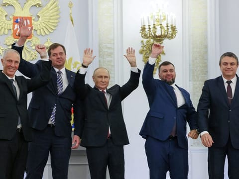 Russian President Vladimir Putin and Denis Pushilin, Leonid Pasechnik, Vladimir Saldo, Yevgeny Balitsky, who are the Russian-installed leaders in Ukraine's Donetsk, Luhansk, Kherson and Zaporizhzhia regions, attend a ceremony to declare the annexation of the Russian-controlled territories, in the Georgievsky Hall of the Great Kremlin Palace in Moscow, on September 30, 2022.