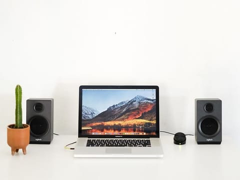 Some speakers will connect to both your laptop and desktop, adding enhanced sound and improving your entire experience.