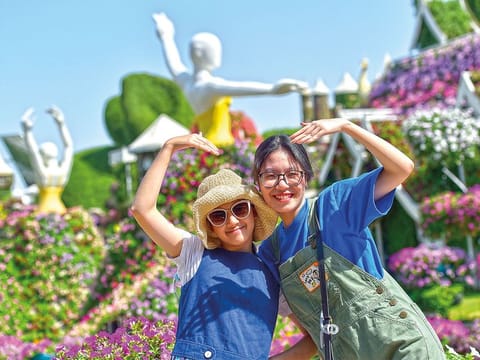 Tourists and visitors take in the sights at Dubai Miracle Garden, which boasts some 150 million flowers of more than 120 varieties.