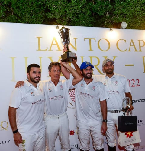 Lan To Capital Luxury Polo Cup 2022 winner Monte Carlo team with the trophy at the Dubai Polo & Equestrian Club.