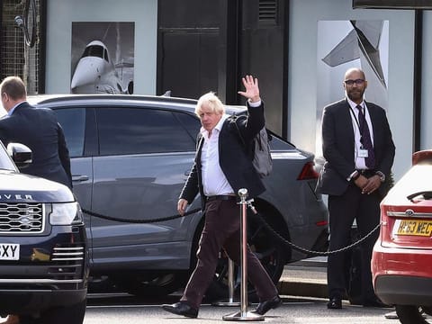 Former British Prime Minister Boris Johnson at Gatwick Airport, near London, on October 22, 2022. Boris Johnson arrived back in Britain on Saturday as he considers an audacious attempt to win a second term as prime minister only weeks after he was forced to step down, with some colleagues warning his comeback could create more political chaos.