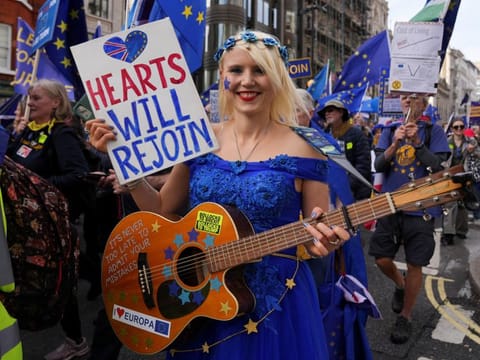 Protesters take part in a march calling for Britain to rejoin the European Union, in London, on October 22, 2022. A lot of Britons are beginning to wonder why they are not getting a chance to influence who is their next leader.