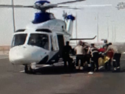 The injured being airlifted into a helicopter.