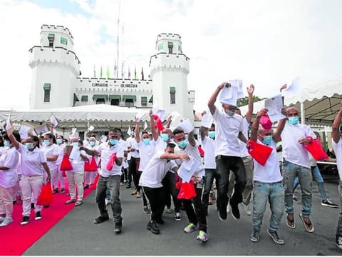 Former inmates celebrate as they step out of New Bilibid Prison after their release.