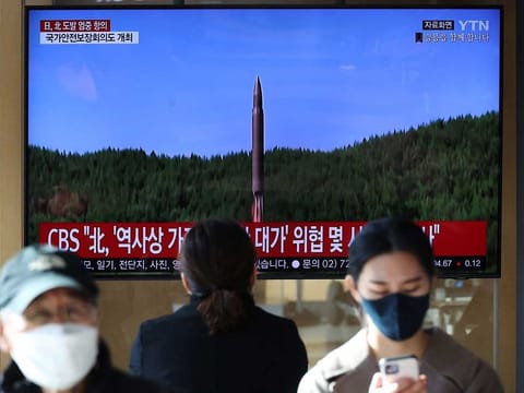 People watch a TV broadcasting a news report on North Korea firing a ballistic missile off its east coast, in Seoul, South Korea, November 2, 2022.