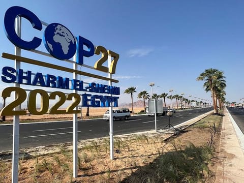 View of a COP27 sign on the road leading to the conference area in Egypt's Red Sea resort of Sharm Al Sheikh town.