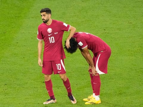Qatar's Hassan Al-Haydos (left) and Akram Afif react after the World Cup group A defeat against Senegal, at the Al Thumama Stadium in Doha, Qatar. It means Qatar have been eliminated from the tournament.