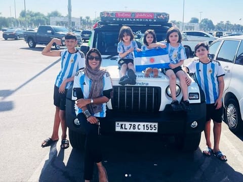 Najira Noushad and five children show their support for Argentina during a stopover in Abu Dhabi, en route to their drive to Doha to watch the Qatar World Cup football games. Najira drove around 3,000km from her hometown of Thalassery, Kannur, in the southern Indian state of Kerala to reach Doha.