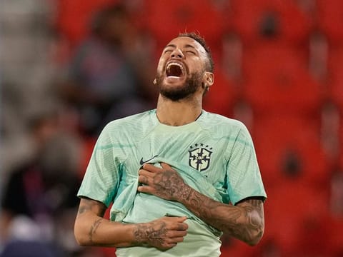 Brazil's Neymar smiles during a training session at the Grand Hamad stadium in Doha, Qatar.