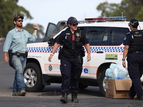 Police work near the scene of a fatal shooting in Wieambilla, Australia, Tuesday, Dec. 13, 2022.