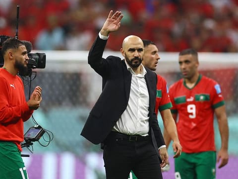 Morocco coach Walid Regragui acknowledges the fans after the match as Morocco are eliminated from the World Cup.