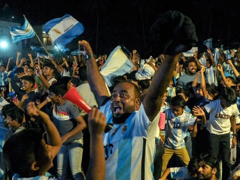 Fans of Argentina cheer as they watch the FIFA World Cup Qatar 2022 final match against France on a big screen at the Kothi football ground, in Kozhikode on Sunday.