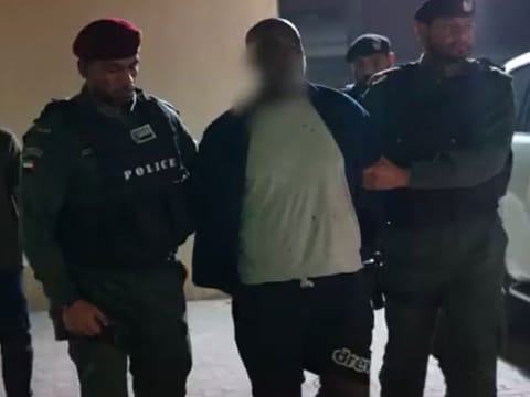 Notorious human smuggler Kidane Zekarias Habtemariam, being taken away by Interpol team after arrest in the UAE-led operation in Sudan.