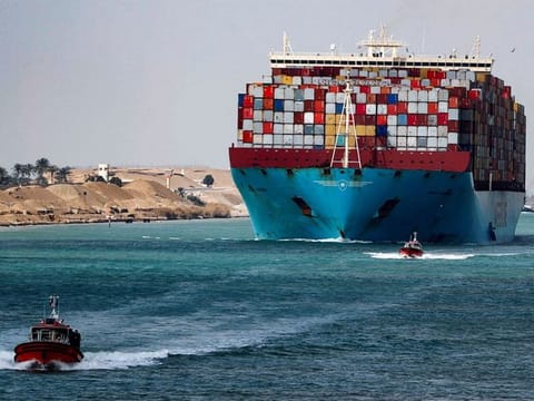 A shipping container passes through the Suez Canal in Suez, Egypt. For illustrative purposes only