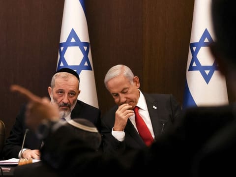 Israel's Prime Minister Benjamin Netanyahu with Interior and Health Minister Aryeh Deri during a weekly Cabinet meeting at the Prime Minister's office in Jerusalem, on January 8, 2023.