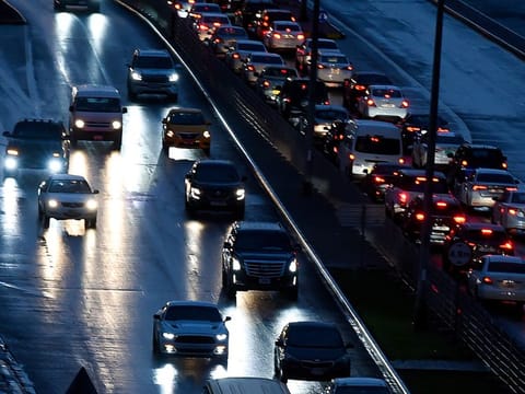 Motorists during the early morning rain on Khalidiya Street in Sharjah on Wednesday.