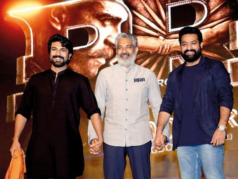 S.S. Rajamouli (centre), director of RRR, with the movie’s star protagonists, NT Rama Rao Jr (right) and Ram Charan at a promotional event for RRR in Mumbai last year
