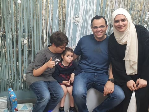 Lulu (second from left) with her brother Omar (left), father Samy Hasanin and mother Asmaa.