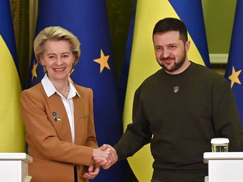 Ukrainian President Volodymyr Zelensky and President of the European Commission Ursula von der Leyen shake hands after a joint press conference after talks in Kyiv on February 2, 2023.