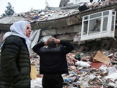 People search for survivors under the rubble following an earthquake in Diyarbakir, Turkey.