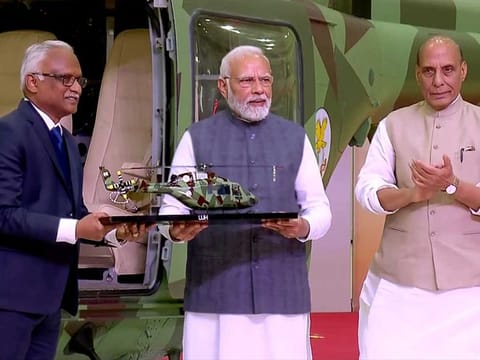 Prime Minister Narendra Modi during the unveiling of the light utility helicopter at HAL's helicopter manufacturing factory, in Tumakuru on Monday, Feb 6, 2023. Defence Minister Rajnath Singh also seen.