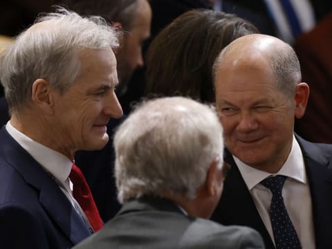 German Chancellor Olaf Scholz (right) stands next to Norway's Prime Minister Jonas Gahr Store (left) as they attend the Munich Security Conference (MSC) in Munich, southern Germany, on February 17, 2023.