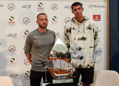 Daniel Evans and Alexei Popyrin with the men's trophy during the official ATP draw ceremony of Dubai Duty Free Tennis Championships on Saturday.