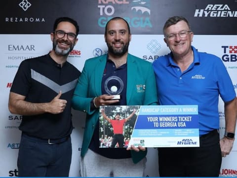 (Left to right) Mishaal Alireza, Hisham Sultan, Division A winner, and Tournament Organiser Keith Watson.