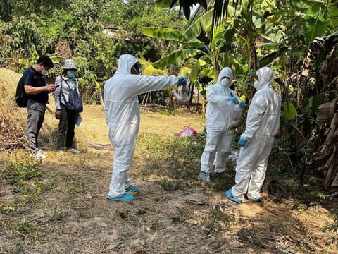 Cambodia health experts work during spray disinfectant at a village in Prey Veng eastern province.