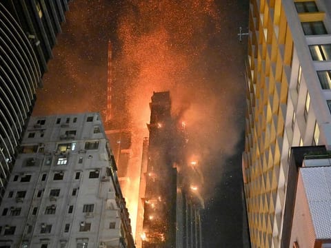 A fire breaks out in an office building in Tsim Sha Tsui, in Hong Kong on early March 3, 2023.