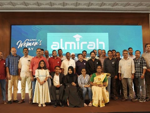Haseena Nishad, Nishad Hussain (seated left) and their daughter Almirah (standing next to them) with the 25 proud expats who received the educational scholarship for their brilliant daughters on the International Women’s Day in Dubai on Wednesday