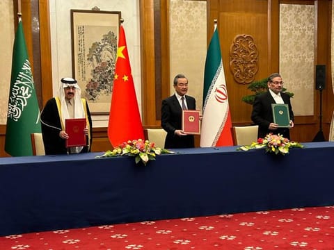From Left: Saudi national security adviser Musaad bin Mohammad Al Aiban, Wang Yi, China's most senior diplomat, and Ali Shamkhani, secretary of Iran’s Supreme National Security Council, in Beijing.