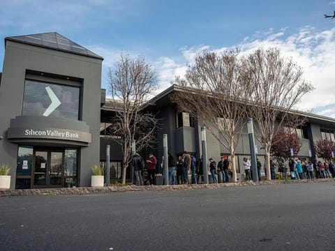 Customers in line outside Silicon Valley Bank headquarters in Santa Clara, California, on Monday, March 13, 2023.