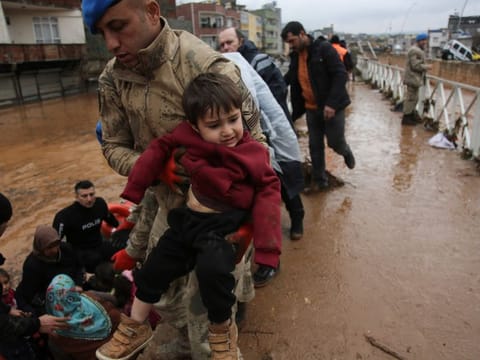 People are rescued during floods after heavy rains in Sanliurfa, Turkey, on March 15, 2023.
