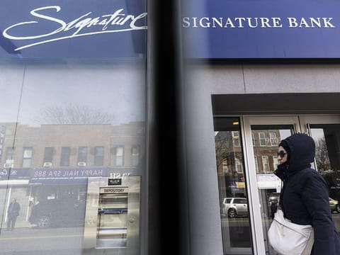 Signage outside a Signature Bank branch in the Brooklyn borough of New York.
