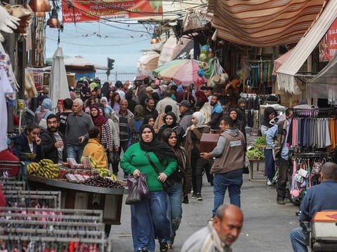 People shop at a souk ahead of the fasting month of Ramadan, in Sidon, Lebanon March 22, 2023.
