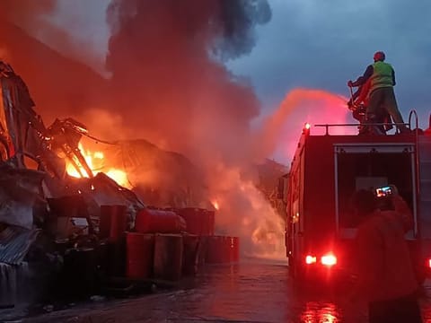 This handout photograph released by Pakistan's Emergency Rescue 1122 Service on April 4, 2023 shows firefighters trying to extinguish a fire that erupted at a warehouse of a hydropower dam construction site in Dasu, the main town in Upper Kohistan district of Pakistan's Khyber Pakhtunkhwa province.