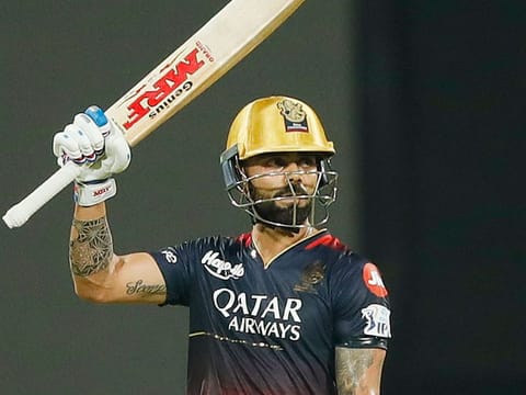 Virat Kohli celebrates his half-century during Royal Challengers Bangalore's first match against Mumbai Indians in Bengaluru on Sunday.