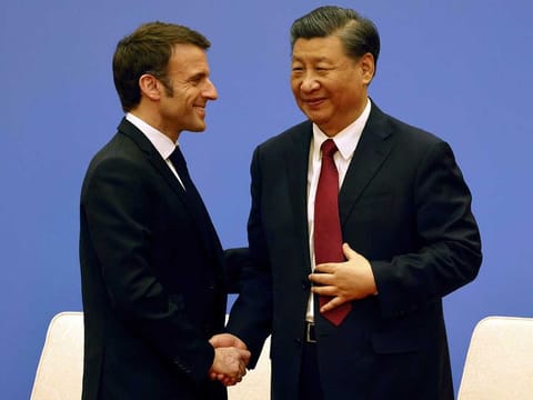 French President Emmanuel Macron, right, and Chinese President Xi Jinping take part in a Franco-Chinese business council meeting in Beijing, Thursday, April 6, 2023.
