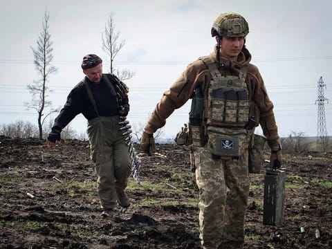 Ukrainian soldiers carry cartridges in their position on the frontline, near Bakhmut, Donetsk region, Ukraine, Friday, April 7, 2023. Newly leaked US intelligence documents offer tactical information about the war in Ukraine.