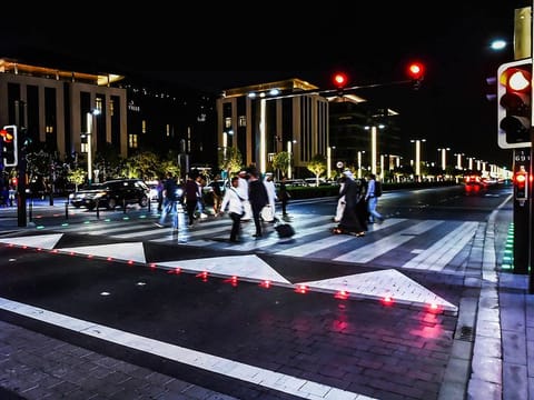 The smart signals have sensors and optical systems to detect movement of people