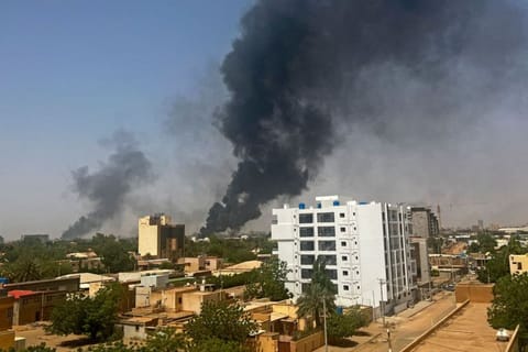 Smoke billows above residential buildings in Khartoum on April 16, 2023, as fighting in Sudan raged for a second day in battles between rival generals.